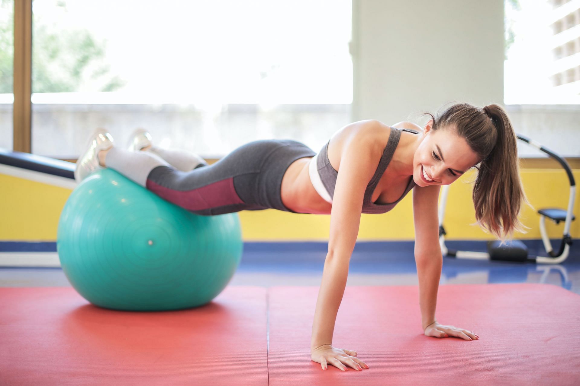 Work on your core and oblique with the exercise ball. ( Image by Andrea Piacquadio / Pexels)
